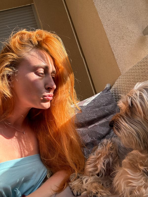 Woman documents afternoon with dog on Budva balcony