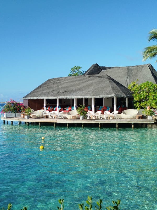 Morning around a Maldives resort: decks, beach swings, and heart ornaments