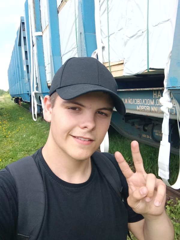 Young man photographed at overgrown railway yard in Andreyevo