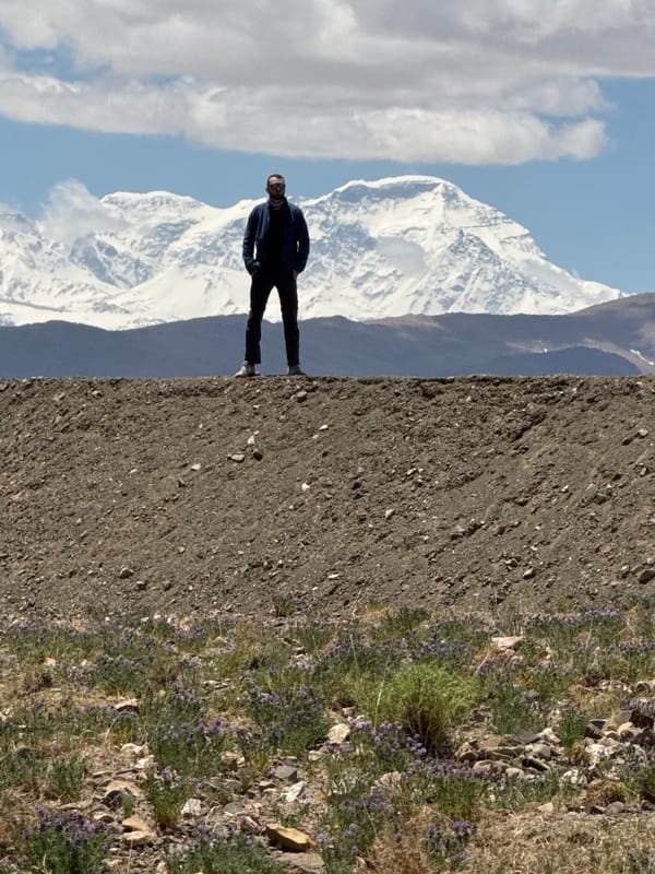 Solo traveler explores remote Gangga mountains at dawn