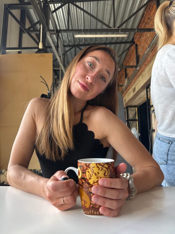 Woman enjoys early morning coffee in Chaikovsky, Russia