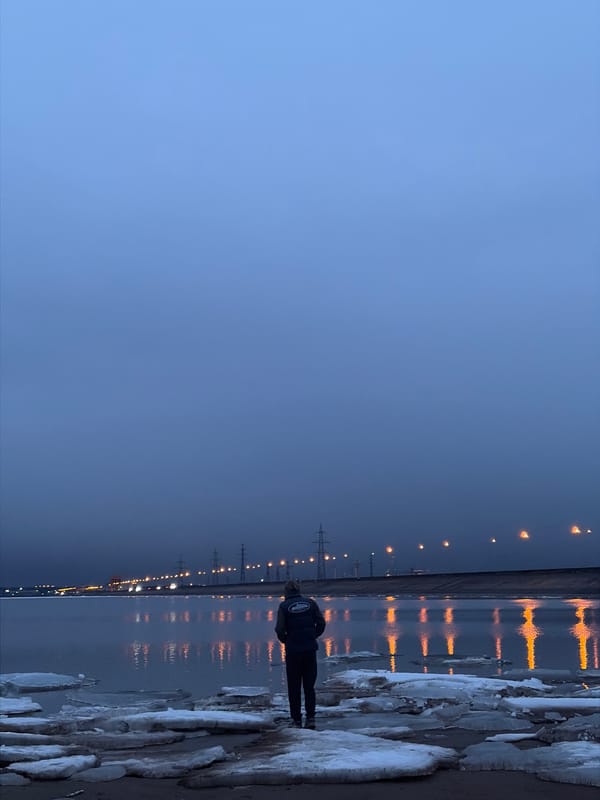 Twilight photography session captured at frozen waterfront in Noviy, Russia