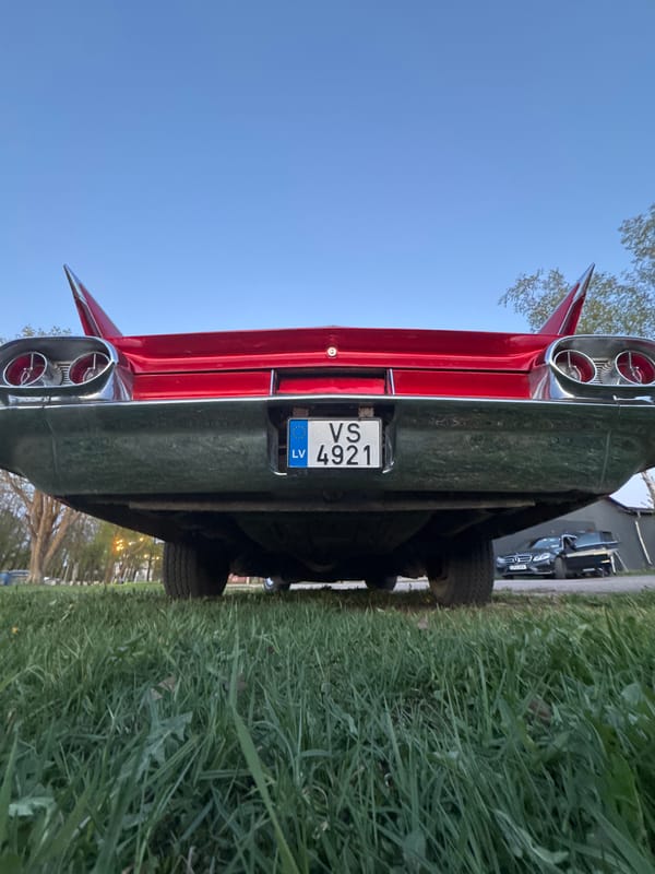 Red vintage car with tailfins spotted in Riga
