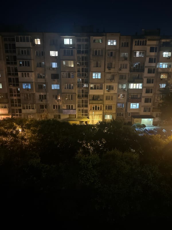 Urban apartment neighborhood from golden hour into night