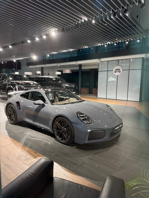 Porsche showroom visit at dusk, Power Yard dealership
