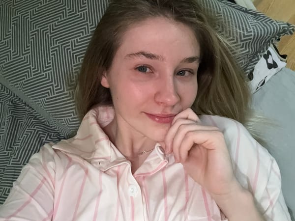 Woman takes bedroom selfies in striped pajamas in Izhevsk