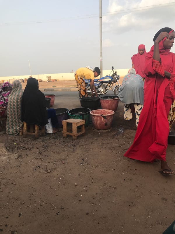 Women gather for roadside trade activities in Lokoja, Nigeria