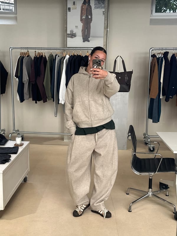 Customer takes mirror selfies in Paris clothing store