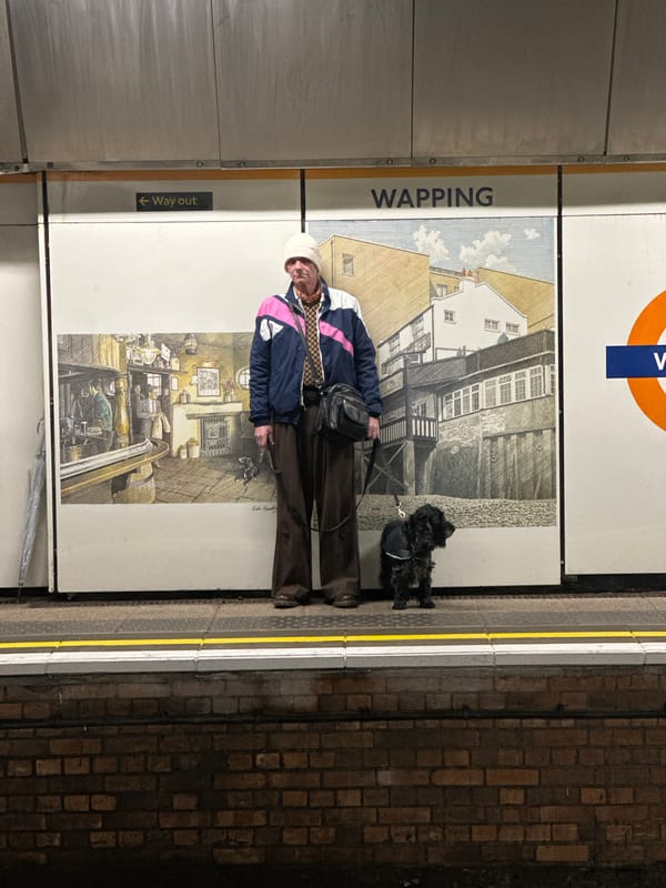 Person with small dog spotted at Wapping Underground station