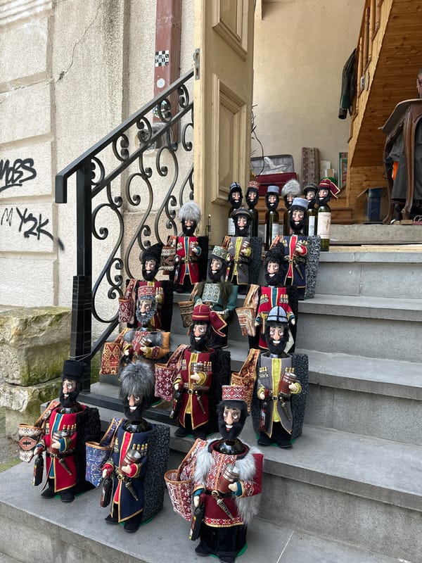 Tourist documents Georgian flags, culture, architecture in Tbilisi old town