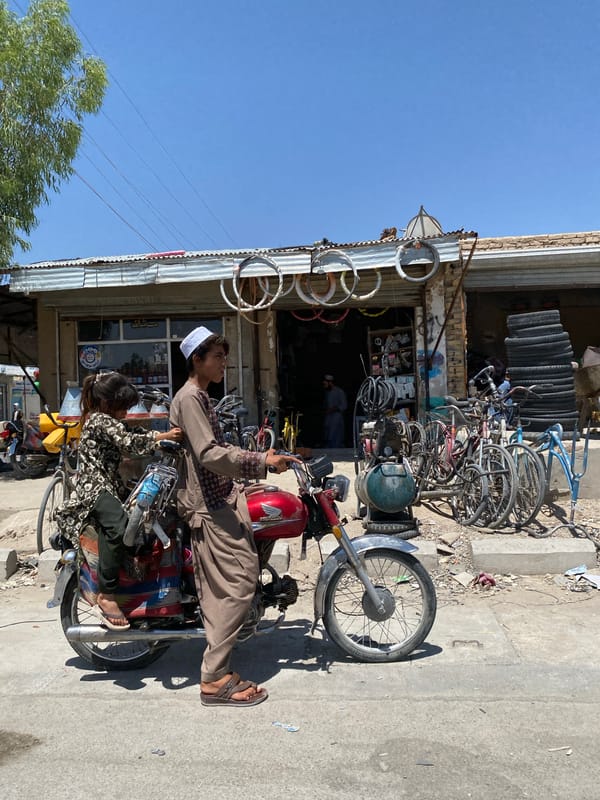 Morning street scenes on motorcycle and bicycle in Kandahar