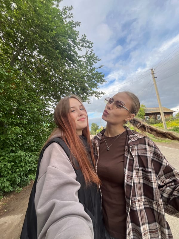 Casual family photos captured during outdoor gathering in rural Russia