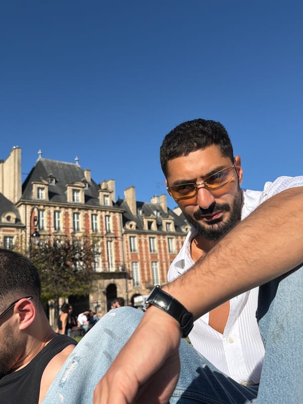 Bearded man spotted outdoors in Paris on sunny afternoon