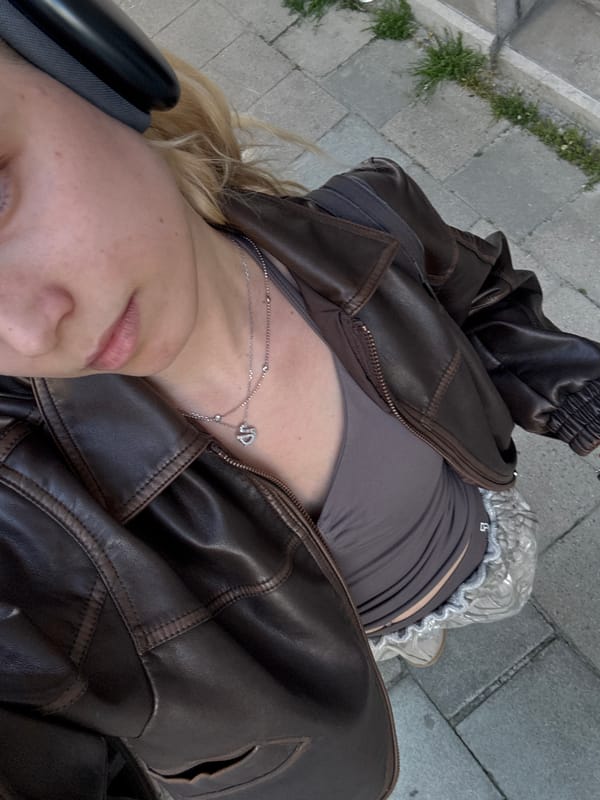 Person photographs self and cityscape in sunny Mechelen