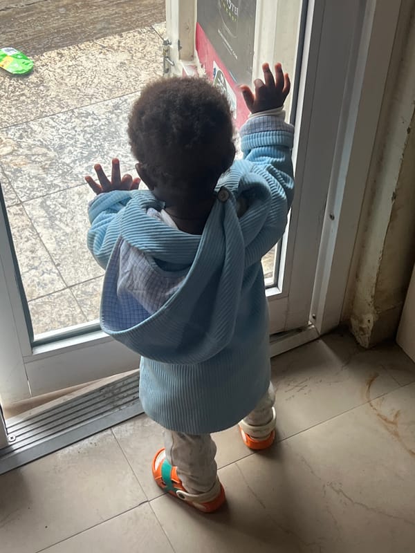 Child plays indoors in Gura Top, Nigeria morning session