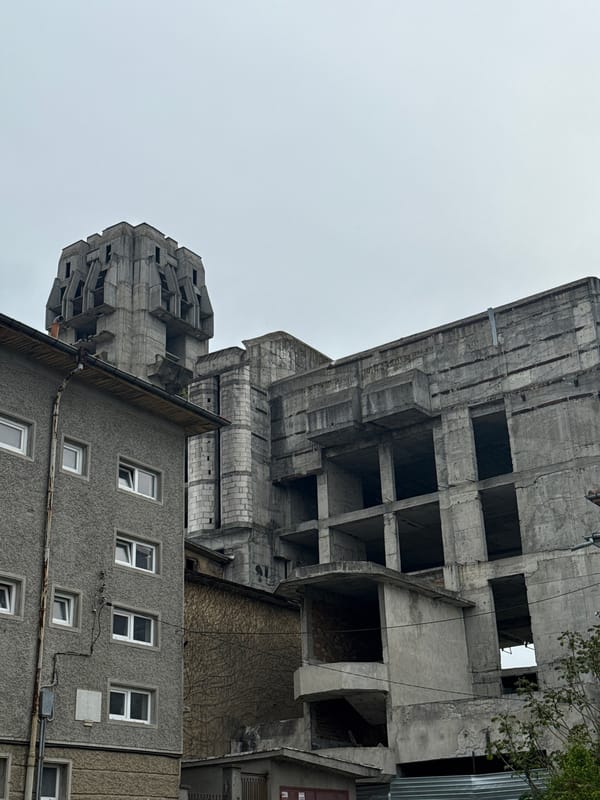 Man drinks energy drink while walking through Shumen, Bulgaria