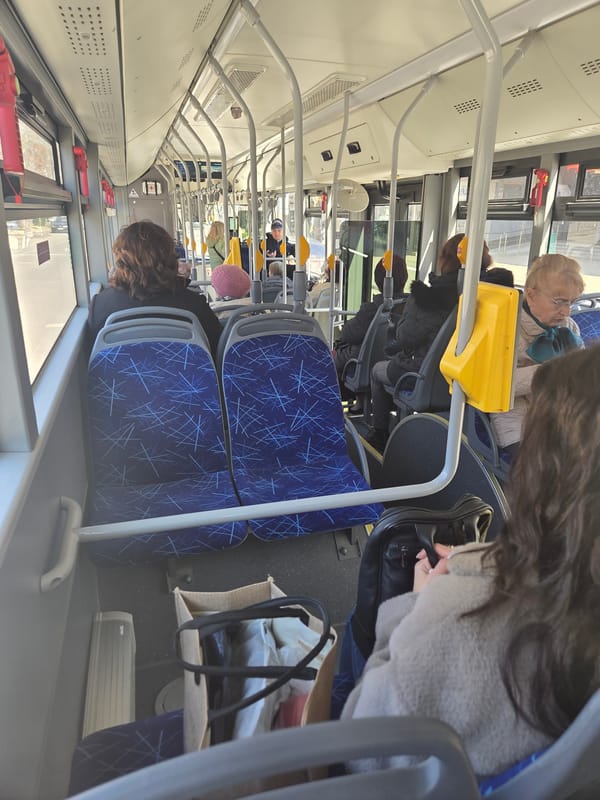 Morning commuters ride public bus in Pleven, Bulgaria