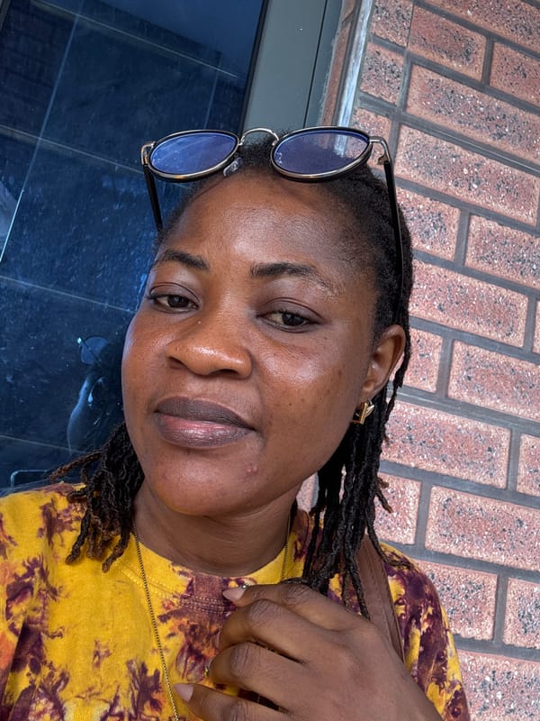 Selfie session against a brick wall in Ajara, Nigeria