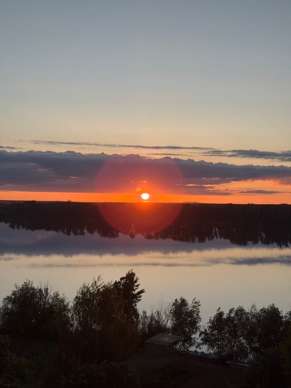 Sunset captured over water in Ольховка, Russia
