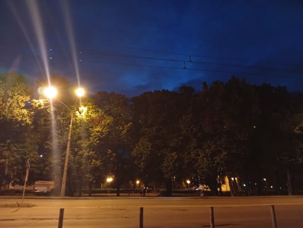 Evening stroll through illuminated Poltava streets and storefronts