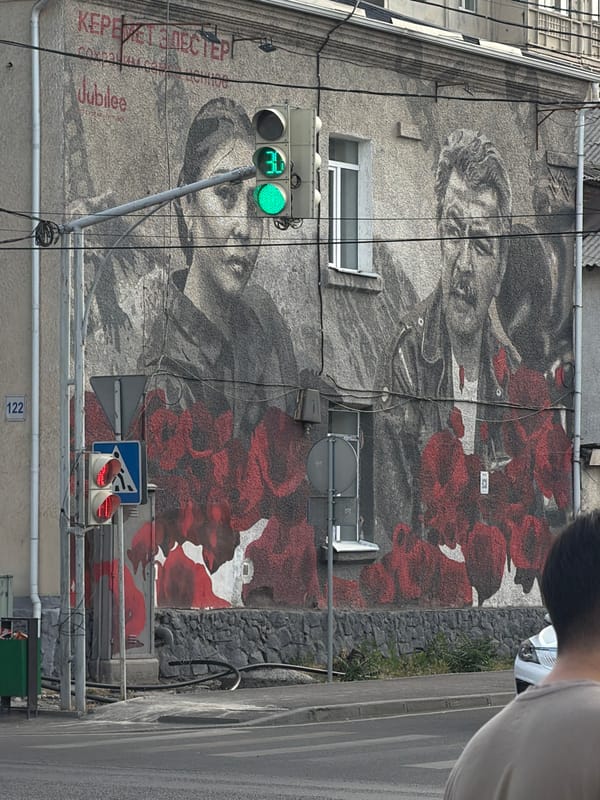 Street art, mosaic sculpture, and mountain views in one urban stretch
