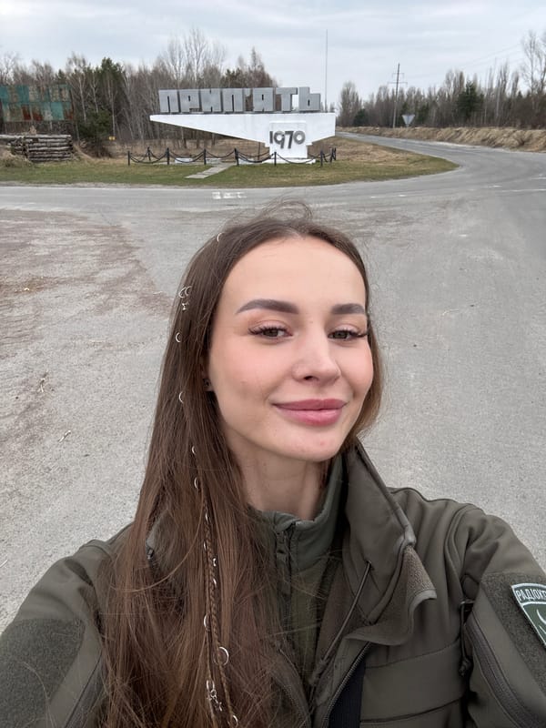 Woman visits Pryp'yat', Ukraine entrance and roadside areas