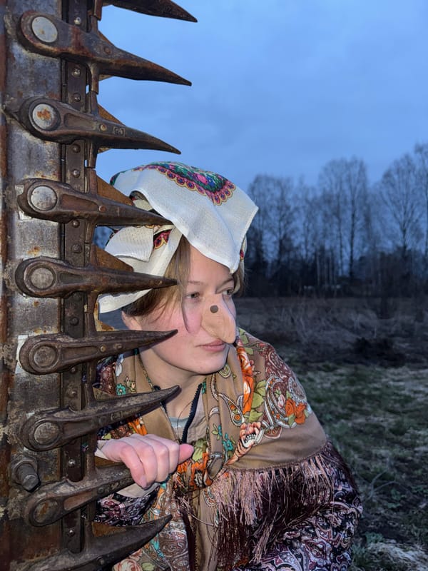 Woman in floral headscarf documented across Вассята, Russia