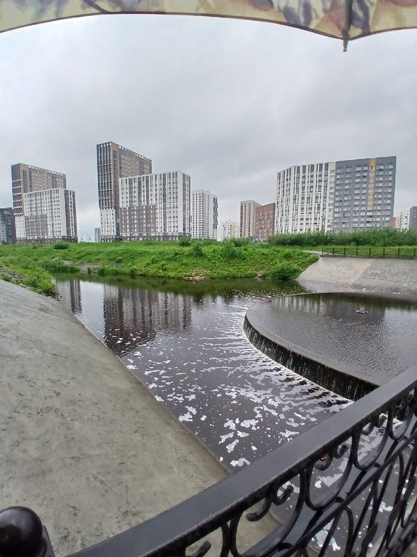 Morning walk documented along Yekaterinburg's Iset River embankment