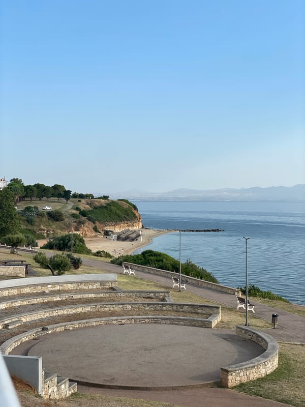 Kassandra coastline at dawn: amphitheater, trees, and calm water