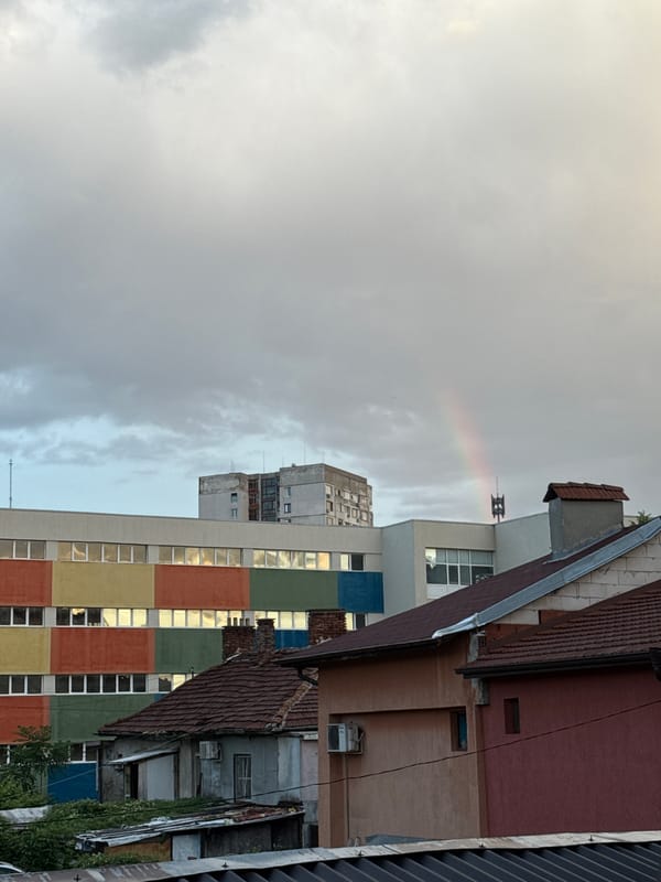 Faint rainbow over Sofia's rooftops on a cloudy evening