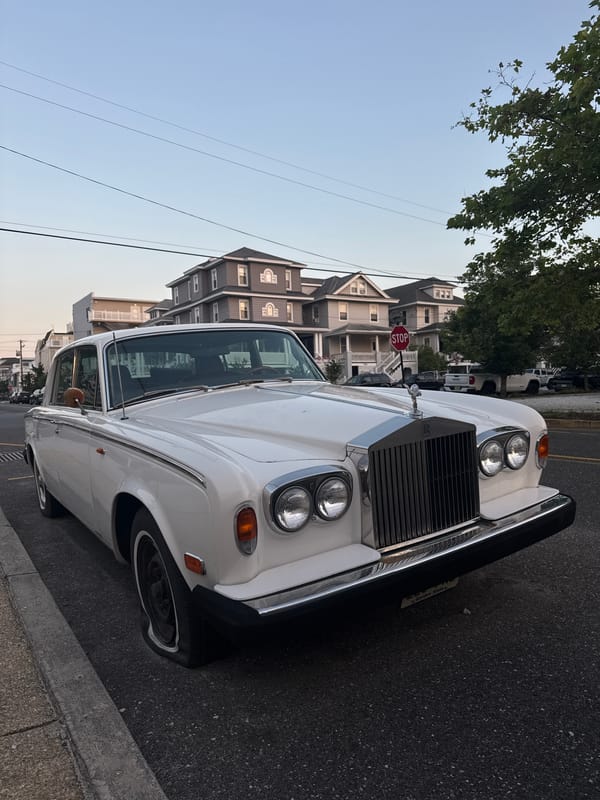 Rolls-Royce with a flat tire parked on an Ocean City street