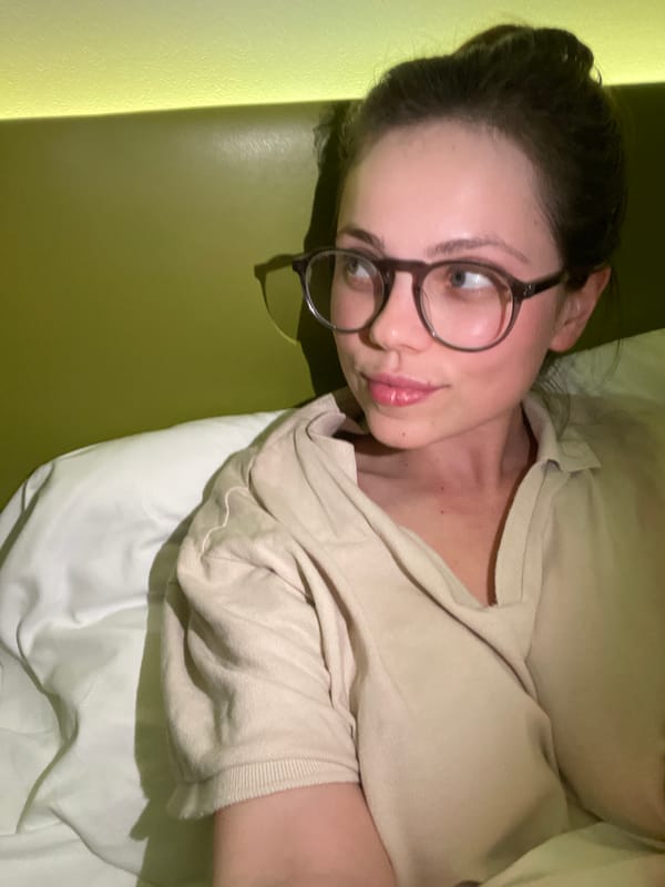 Woman takes bathroom selfies with green iPhone in Venice