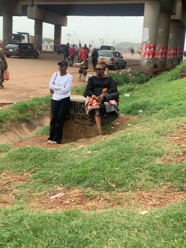 Roadside hustle and foot traffic under Nyanya overpass