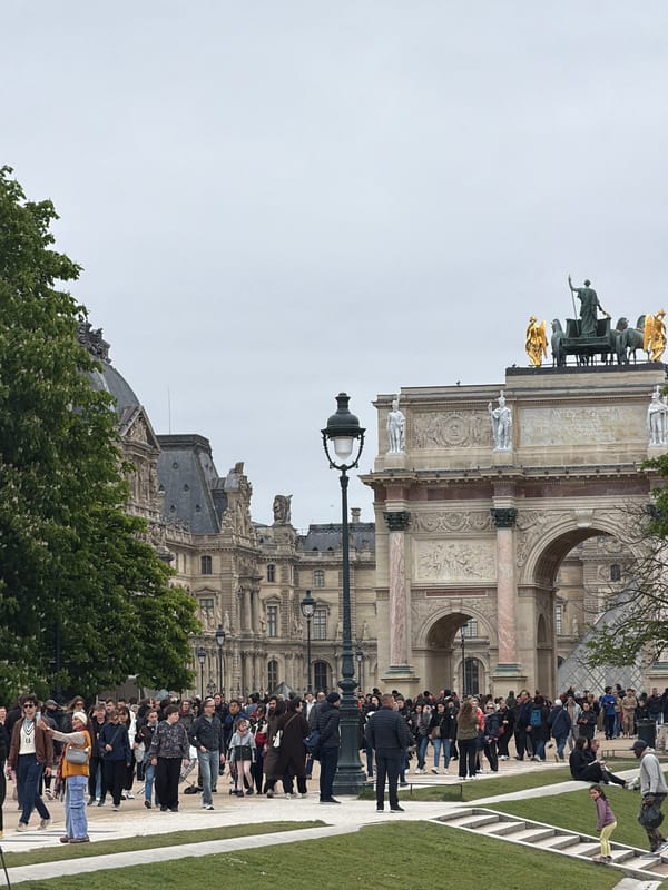 Gold knight statue observed amid tourist queues in Paris