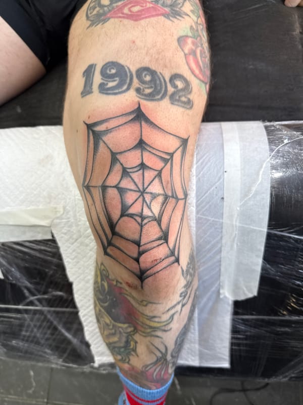 Tattooed arm with spiderweb design observed in Moscow