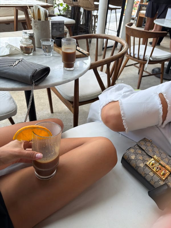 Women share breakfast at outdoor Canggu café