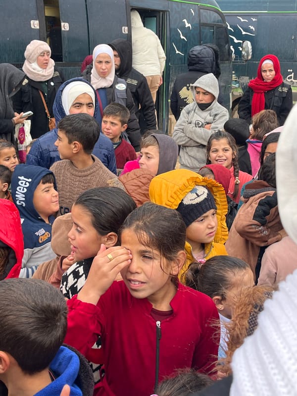 Humanitarian aid distribution draws crowds at Syrian refugee camps