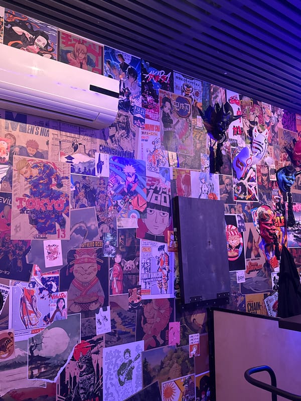 Anime-themed club restaurant captured during evening social activity