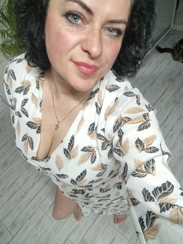 Woman Takes Multiple Selfies in Grishanki, Russia During Evening