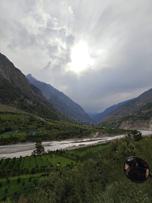 Dramatic mountain valley and terraced fields under stormy skies, Jahlmah