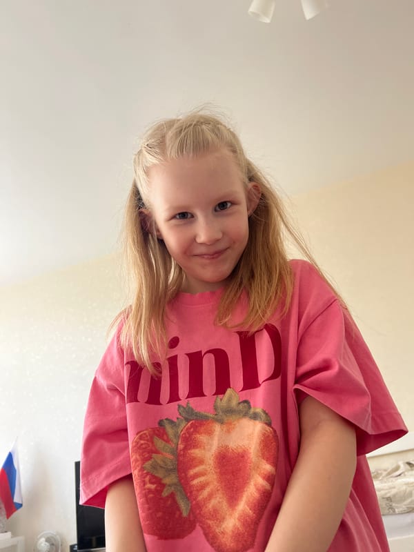 Girl in strawberry shirt photographed indoors in Yekaterinburg