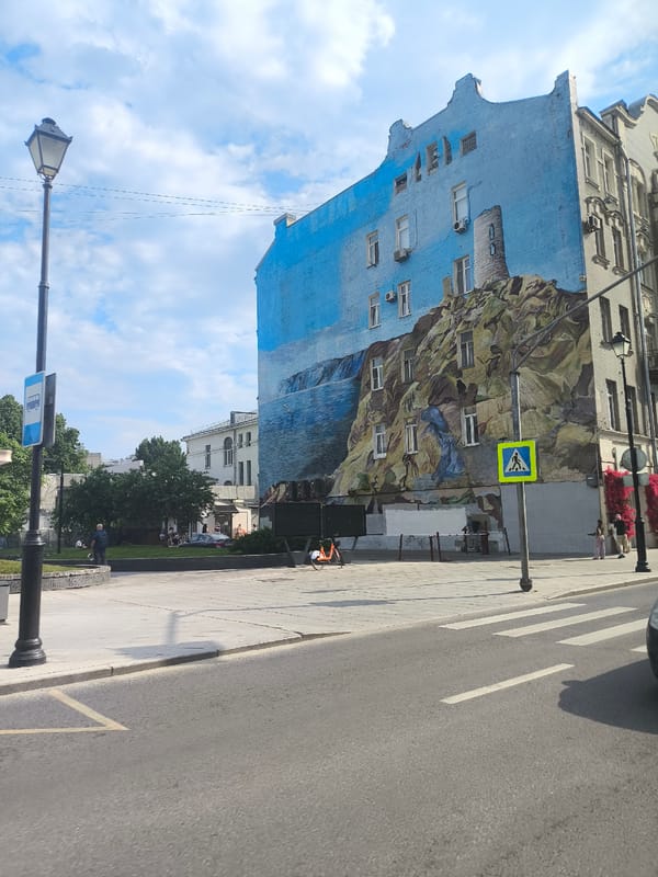 Moscow street scenes captured showing mural, restaurant, Orthodox church