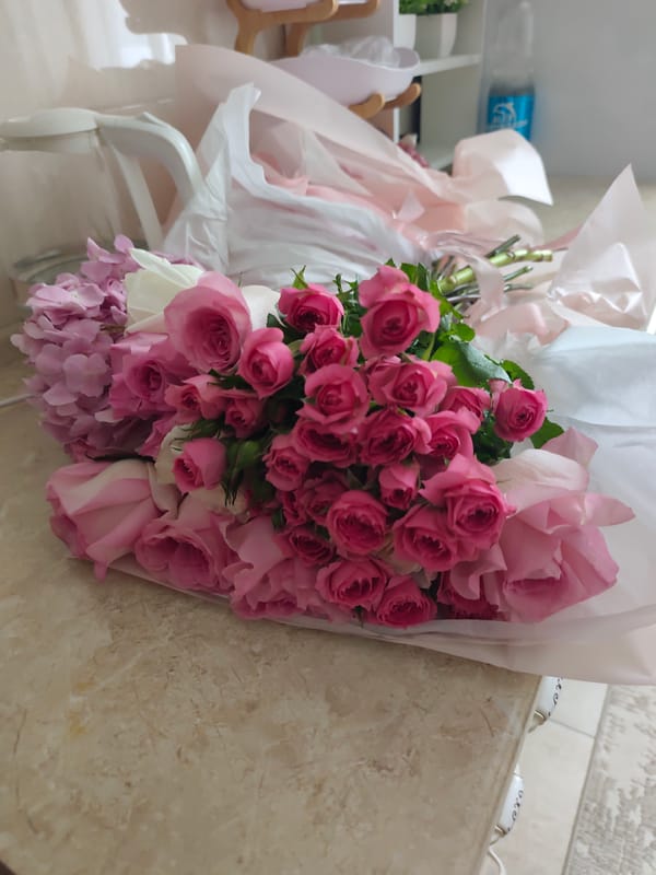 Pink and white roses arranged at a home in Astana