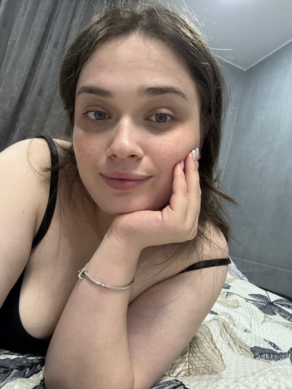 Woman rests on bed in Chaikovsky, Russia