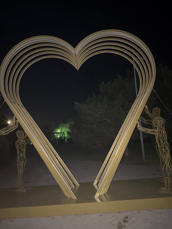 Evening in a Egorlykskaya park built around a golden heart sculpture