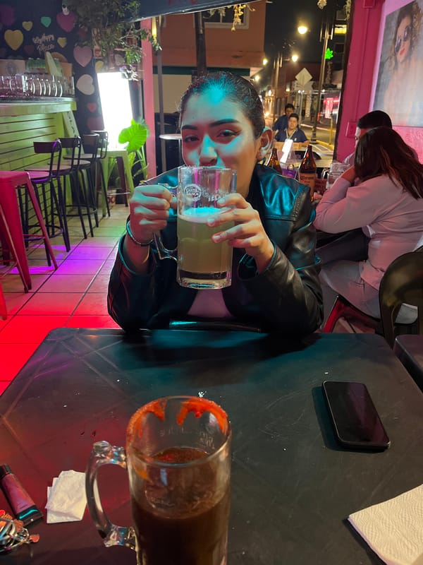 Woman enjoys beer at San Andrés Cholula establishment