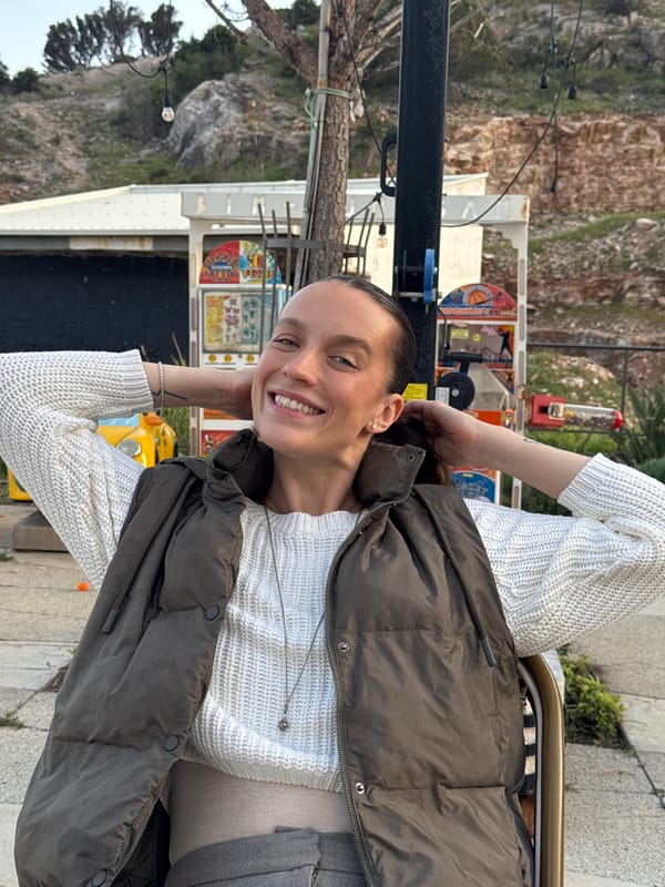 Woman photographed at outdoor tables in Sutomore, Montenegro