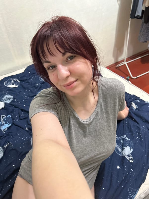 Woman resting on bed in Russian home