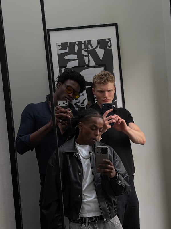 Group takes mirror selfies in London interior