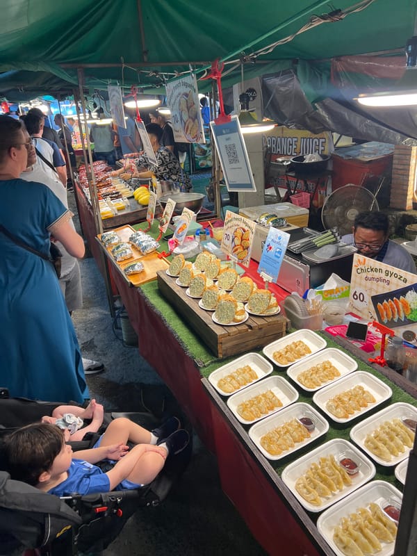 Night market food vendors and vehicles documented in Thailand